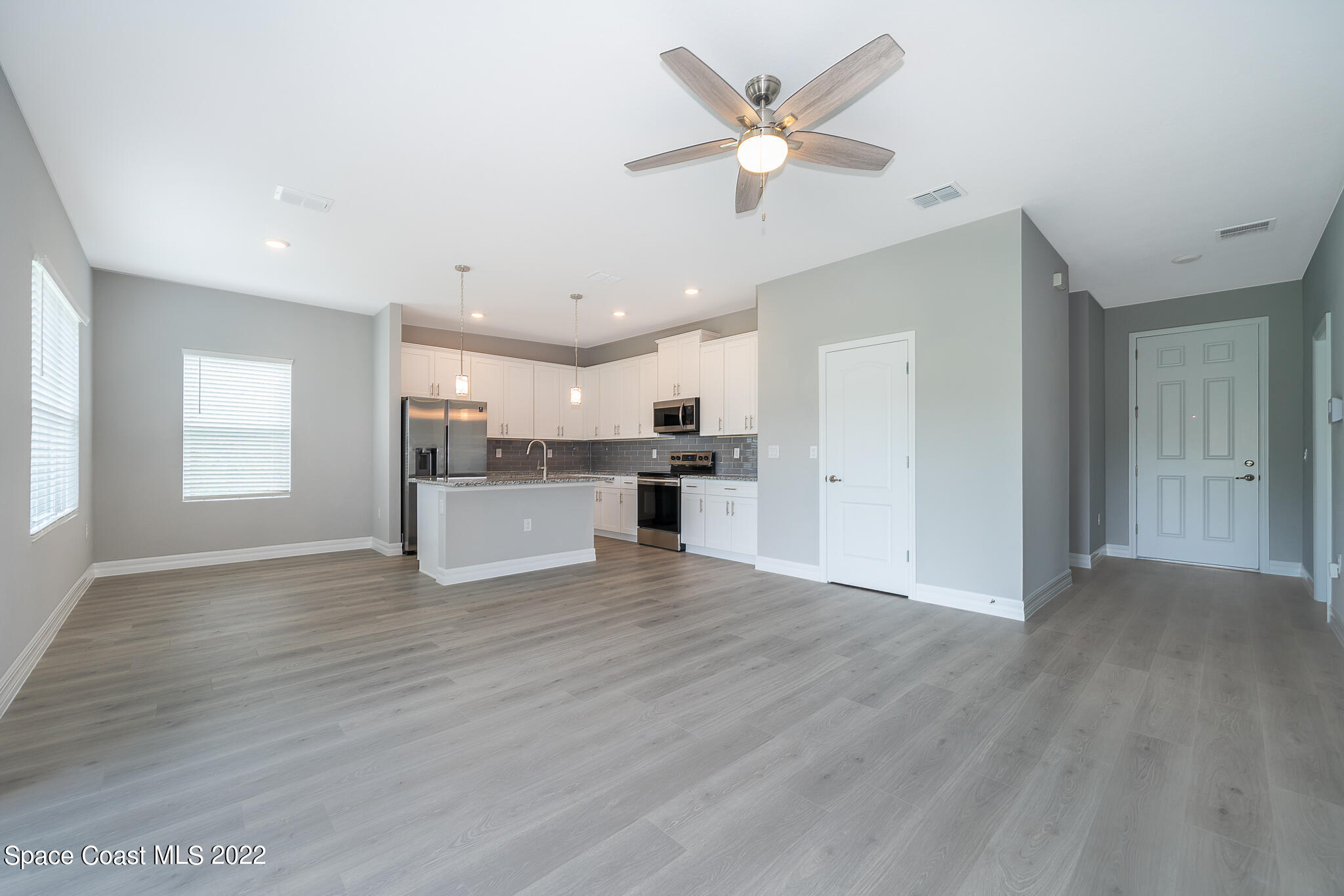 214 Gordon Road Northwest Palm Bay, FL 32907 - Photo 5 of 19 a view of a kitchen with a sink and a stove top oven