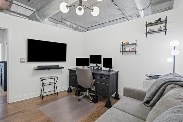 a view of a livingroom with furniture and a flat screen tv