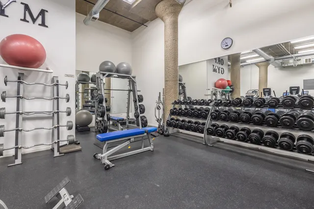 a room with gym equipment and other equipment