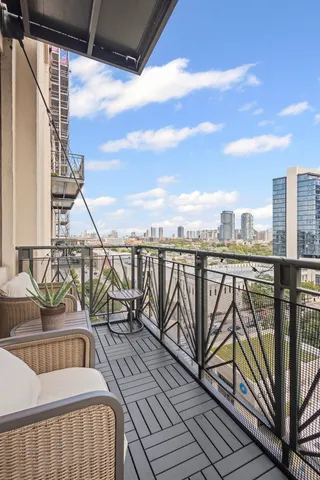 a view of balcony with furniture