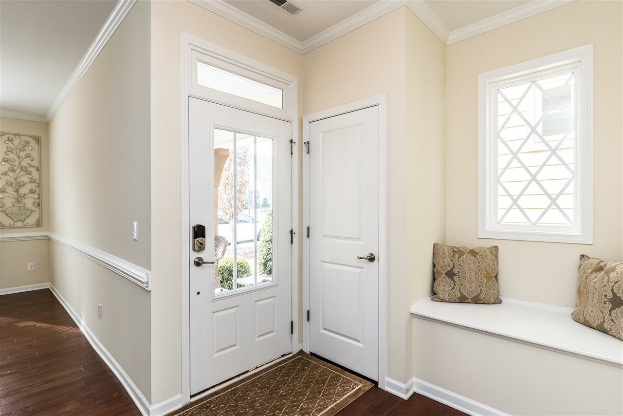 1413 Van Page Boulevard Raleigh, NC 27607 - Photo 3 of 25 BRIGHT FOYER WITH COAT CLOSET AND BUILT IN BENCH. FOYER