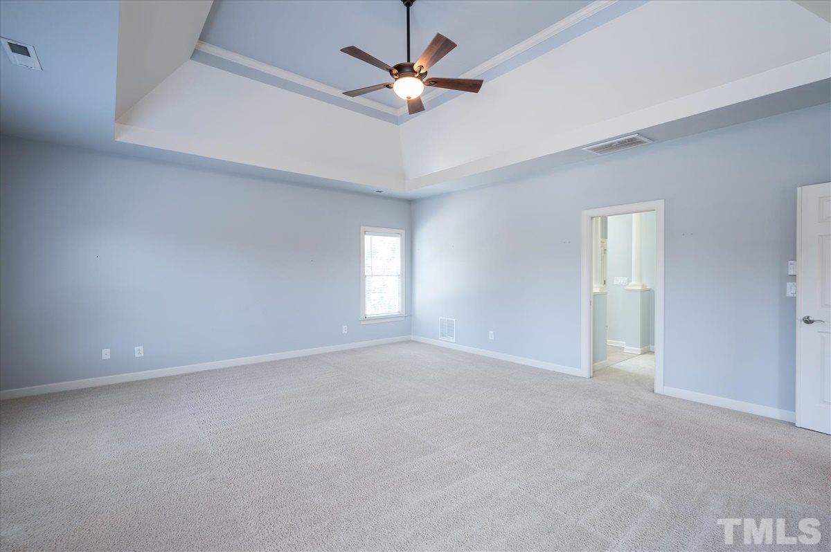 1917 Falls Farm Crossing Raleigh, NC 27614 - Photo 13 of 30 Master Bedroom is huge--tray ceiling. The entire home was painted in 2018 the #1 Sherwin Williams gray, "repose gray."