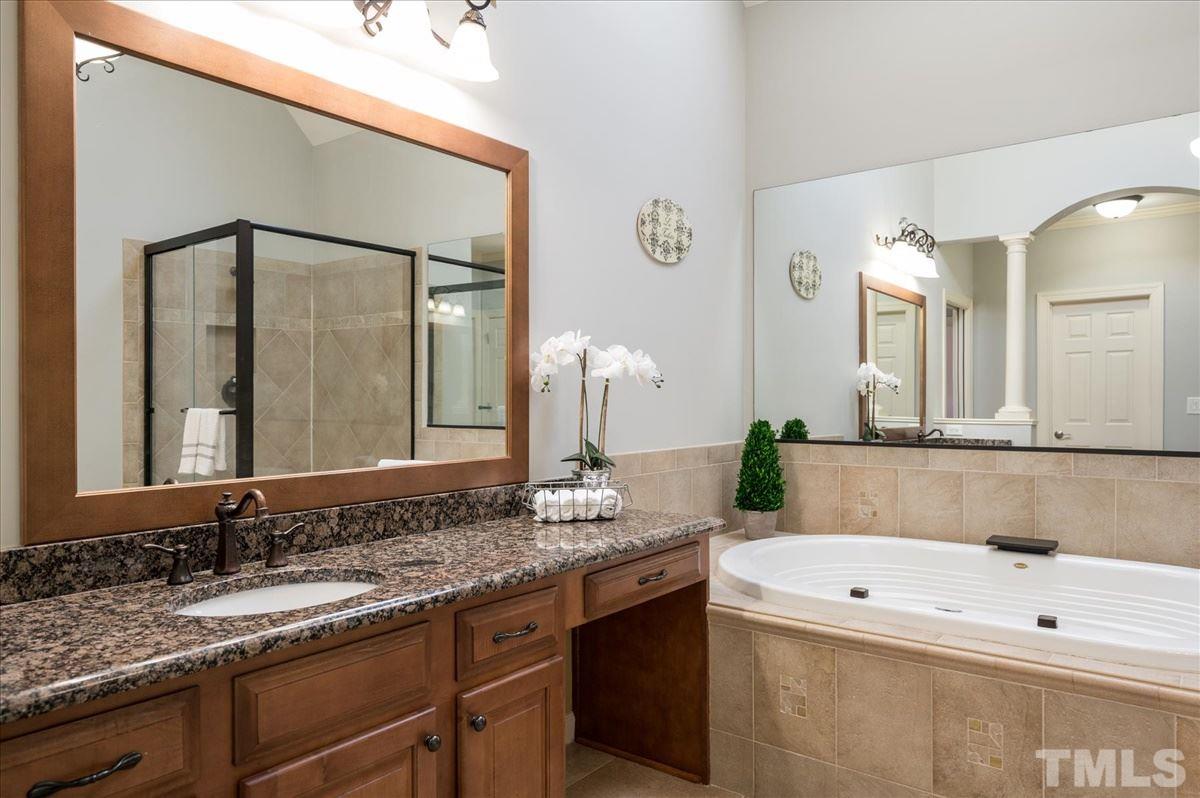 1917 Falls Farm Crossing Raleigh, NC 27614 - Photo 14 of 30 Master Bath has his/her vanities, roman tub, large tile shower, his/her closets AND an office/nursery/exercise room off the bath.