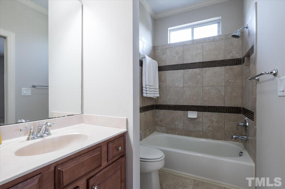 1917 Falls Farm Crossing Raleigh, NC 27614 - Photo 19 of 30 Private Bath off Bedroom #1. Custom Tile work in all the showers in this home.