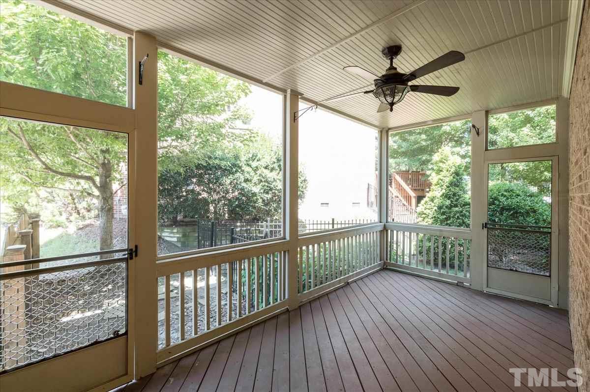 1917 Falls Farm Crossing Raleigh, NC 27614 - Photo 21 of 30 Screened in Side porch with privacy trees, ceiling fan and 2 doors (one to backyard and one to front yard).