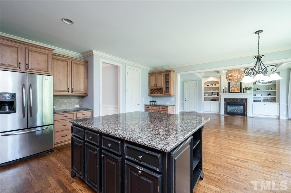1917 Falls Farm Crossing Raleigh, NC 27614 - Photo 6 of 30 Kitchen opens up to eat-in-kitchen area and family room.