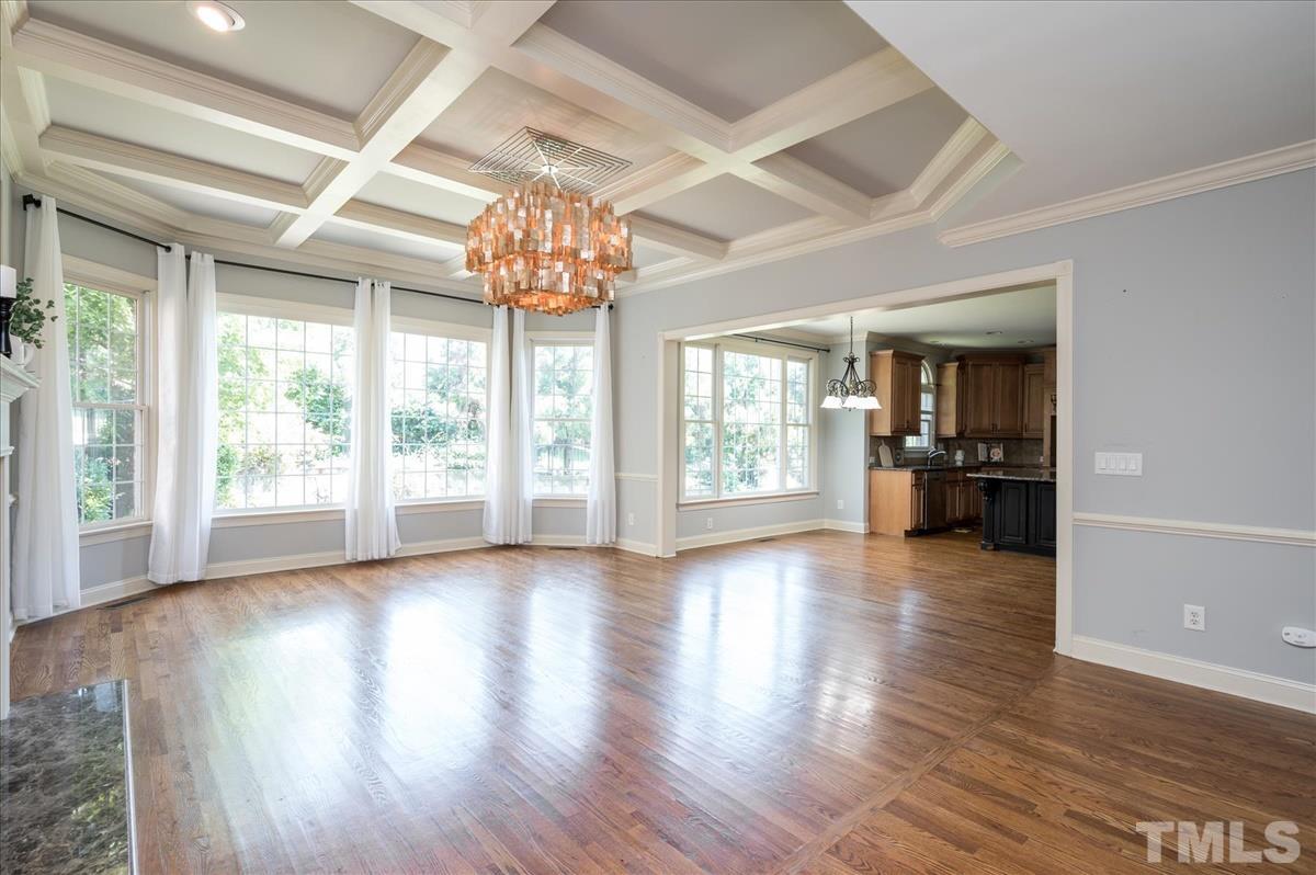 1917 Falls Farm Crossing Raleigh, NC 27614 - Photo 7 of 30 Tall Tray Ceiling, oversized windows and unique light fixture make up this spacious family room.