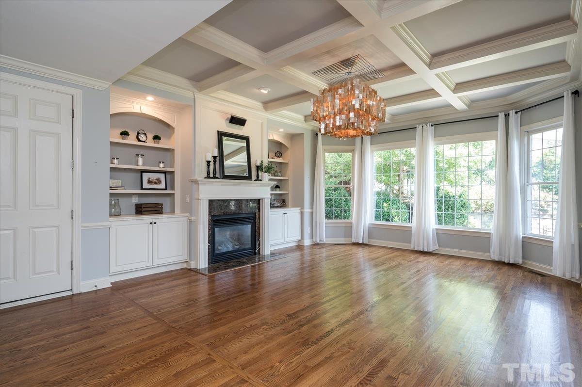 1917 Falls Farm Crossing Raleigh, NC 27614 - Photo 8 of 30 A gas fireplace completes this family room.