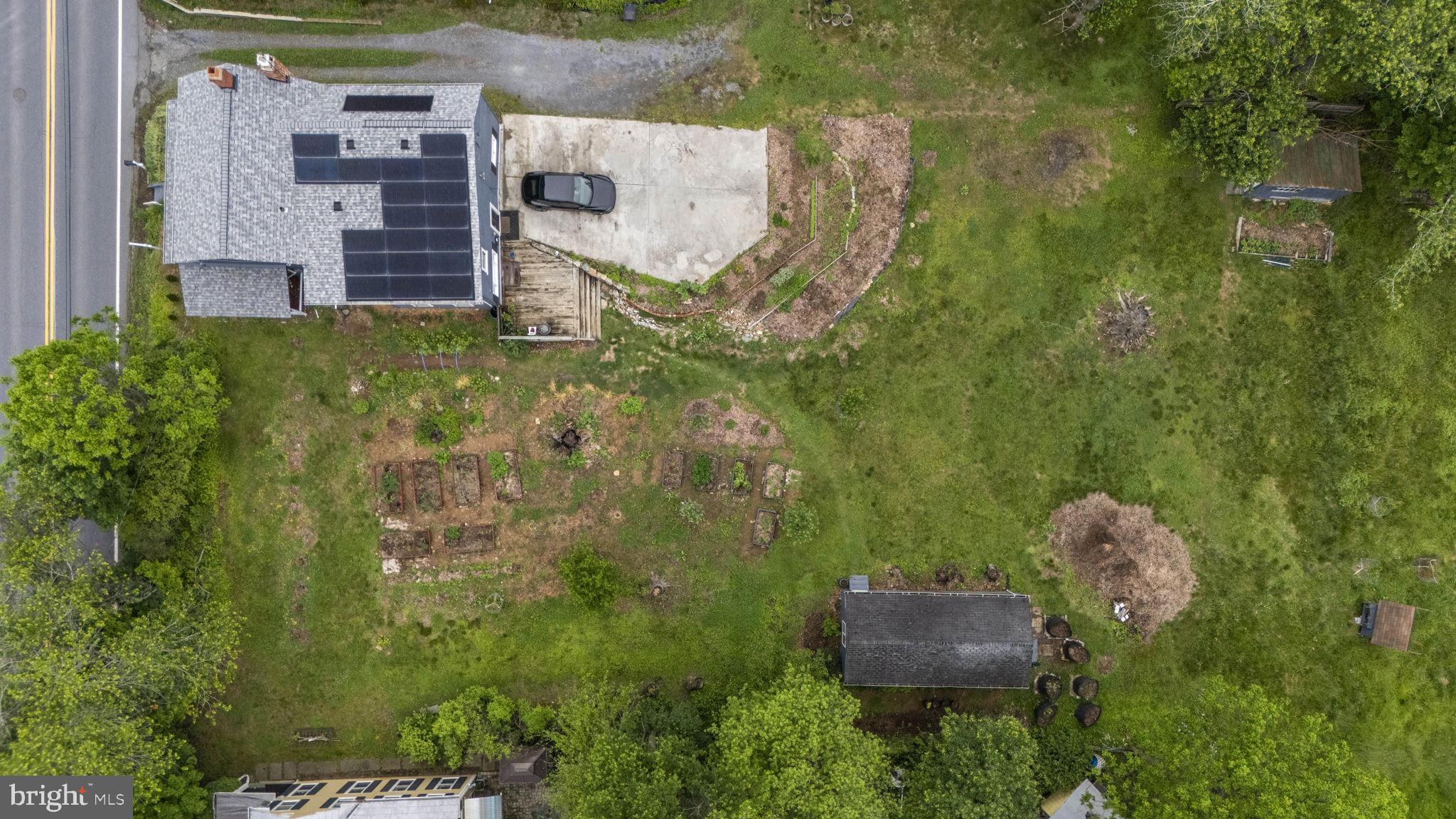 26001 Frederick Road Clarksburg, MD 20871 - Photo 43 of 46 an aerial view of a house with a yard and trees