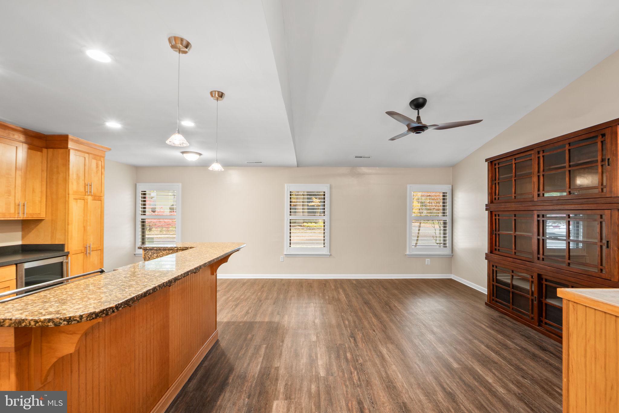 1813 Glade Court Annapolis, MD 21403 - Photo 12 of 35 a large kitchen with stainless steel appliances a large window a oven and a counter space