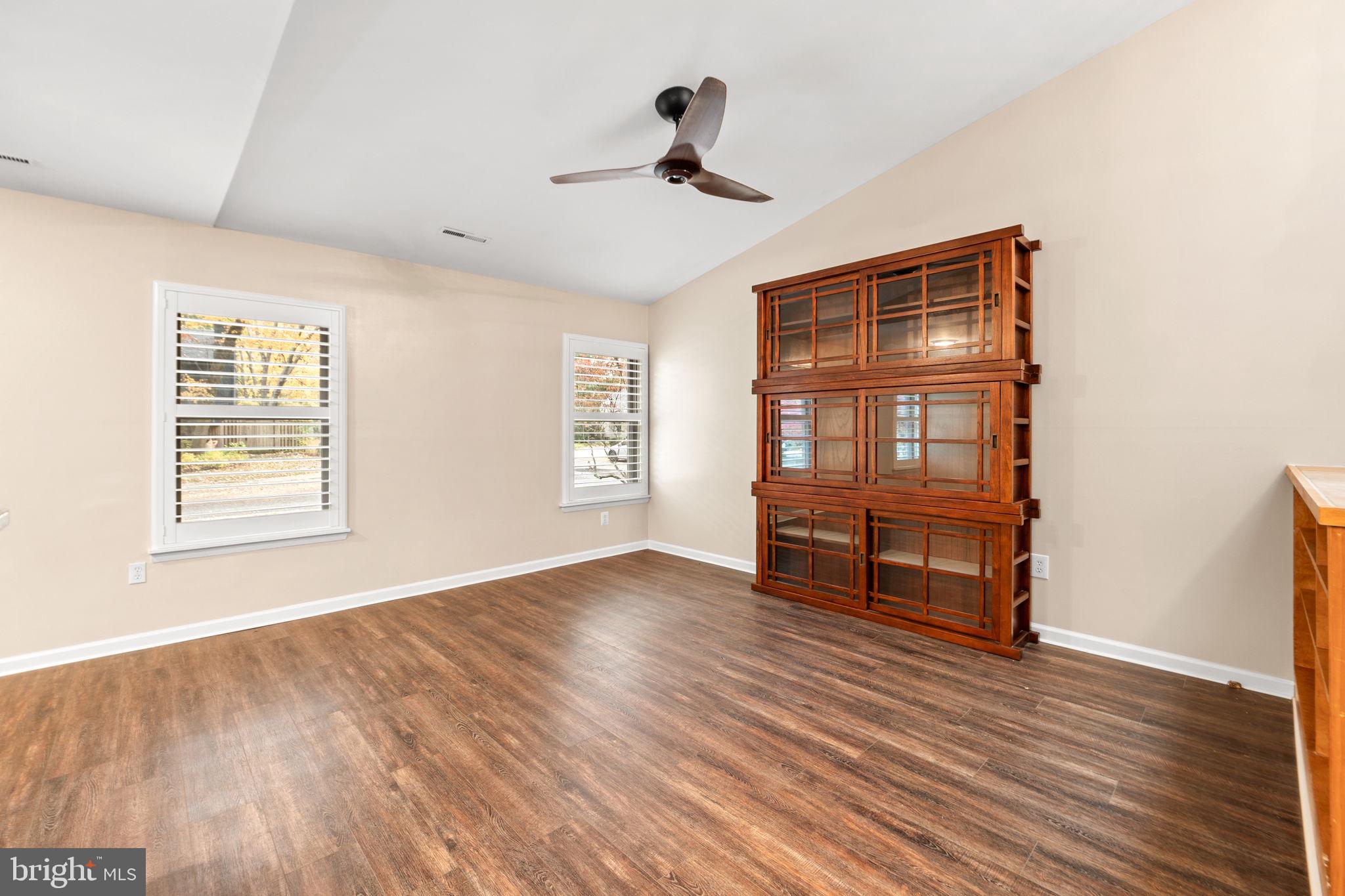 1813 Glade Court Annapolis, MD 21403 - Photo 13 of 35 a view of empty room with wooden floor and fan