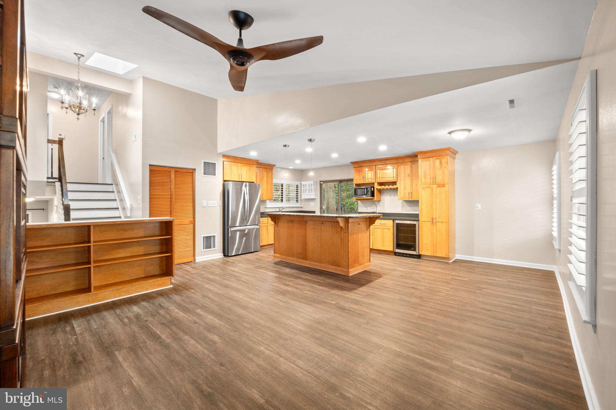 1813 Glade Court Annapolis, MD 21403 - Photo 15 of 35 a view of an empty room with wooden floor and a window