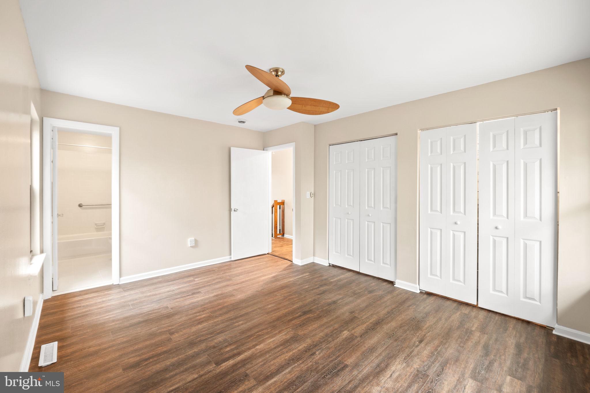 1813 Glade Court Annapolis, MD 21403 - Photo 18 of 35 a view of empty room with wooden floor and fan