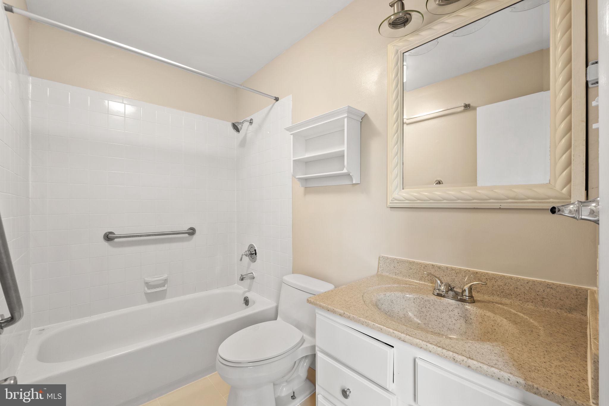 1813 Glade Court Annapolis, MD 21403 - Photo 19 of 35 a bathroom with a granite countertop sink toilet and shower