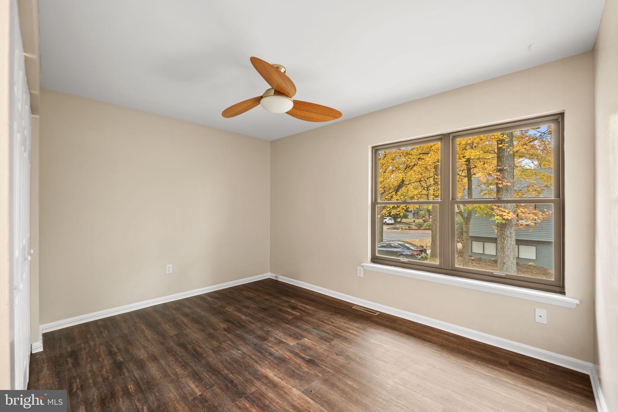 1813 Glade Court Annapolis, MD 21403 - Photo 20 of 35 a view of an empty room with wooden floor and a window