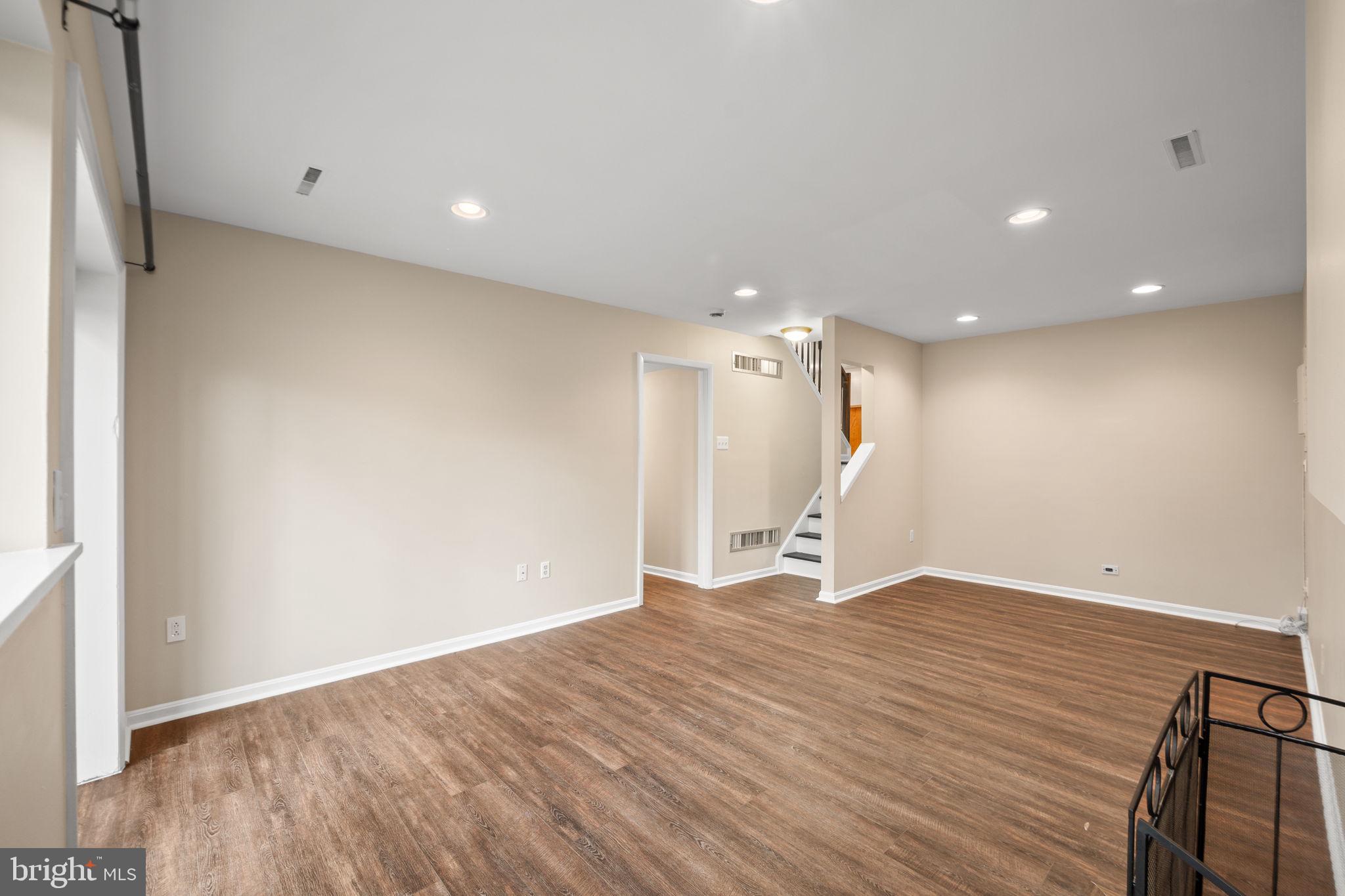 1813 Glade Court Annapolis, MD 21403 - Photo 28 of 35 a view of an empty room with wooden floor