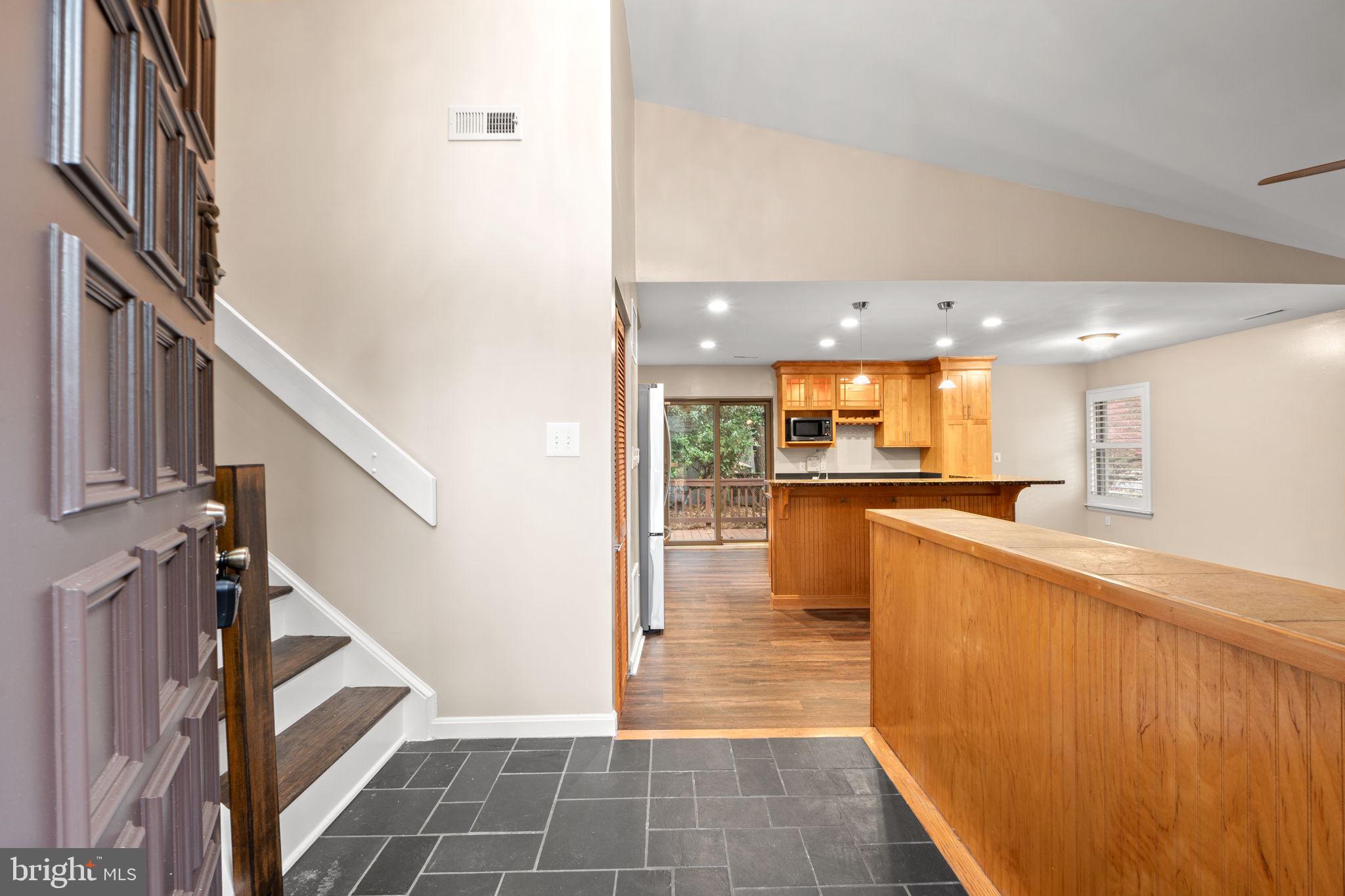 1813 Glade Court Annapolis, MD 21403 - Photo 5 of 35 a view of kitchen with cabinets and wooden floor