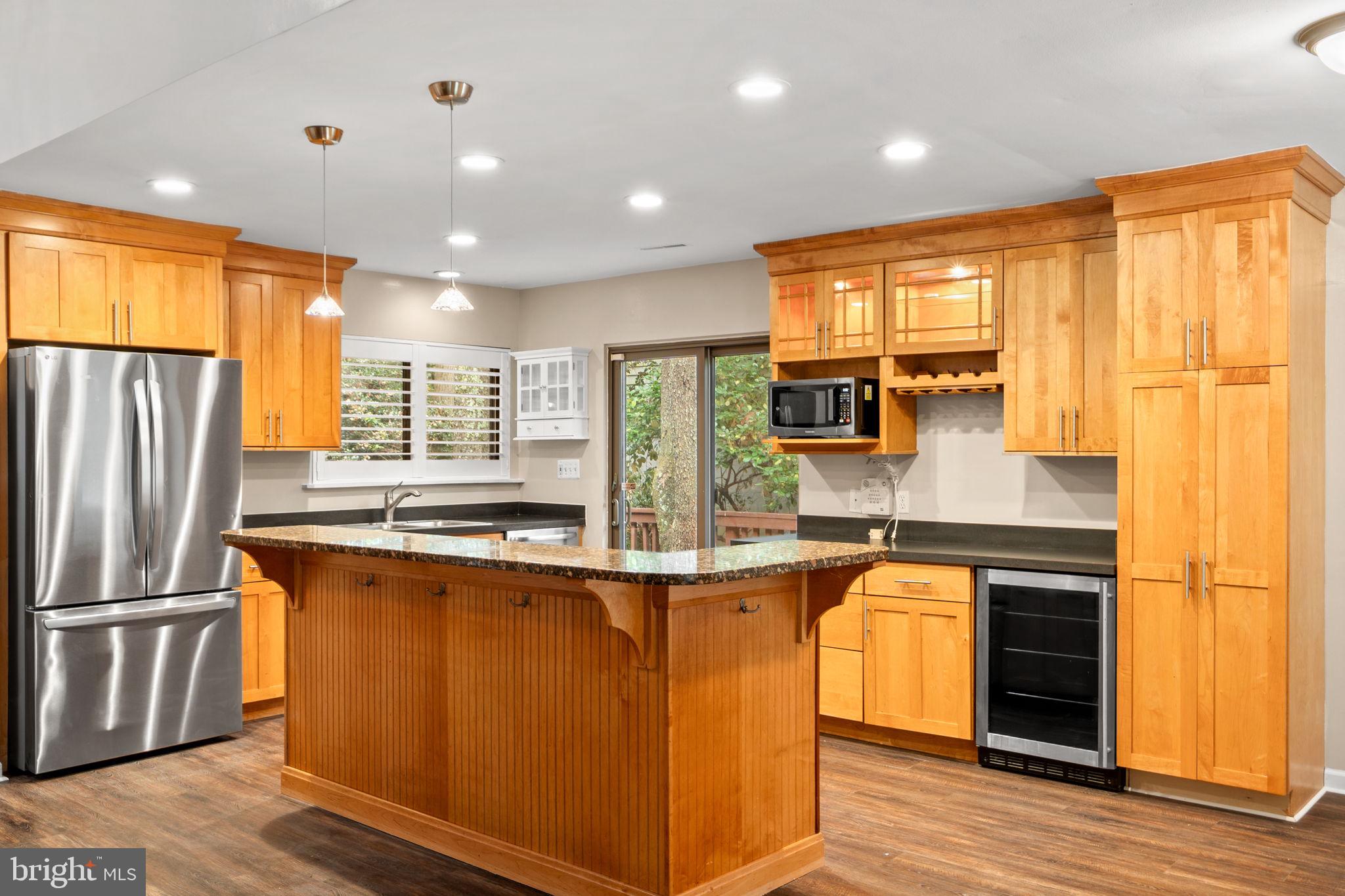 1813 Glade Court Annapolis, MD 21403 - Photo 8 of 35 a kitchen with stainless steel appliances granite countertop a refrigerator a sink and a stove
