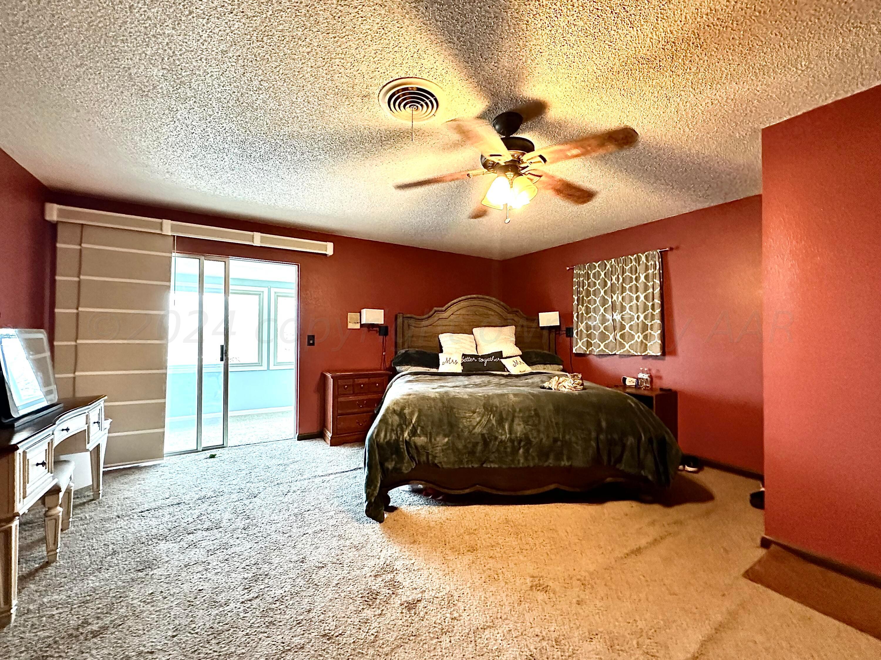1404 Primrose Lane Borger, TX 79007 - Photo 17 of 27 a bedroom with a bed dresser and a window