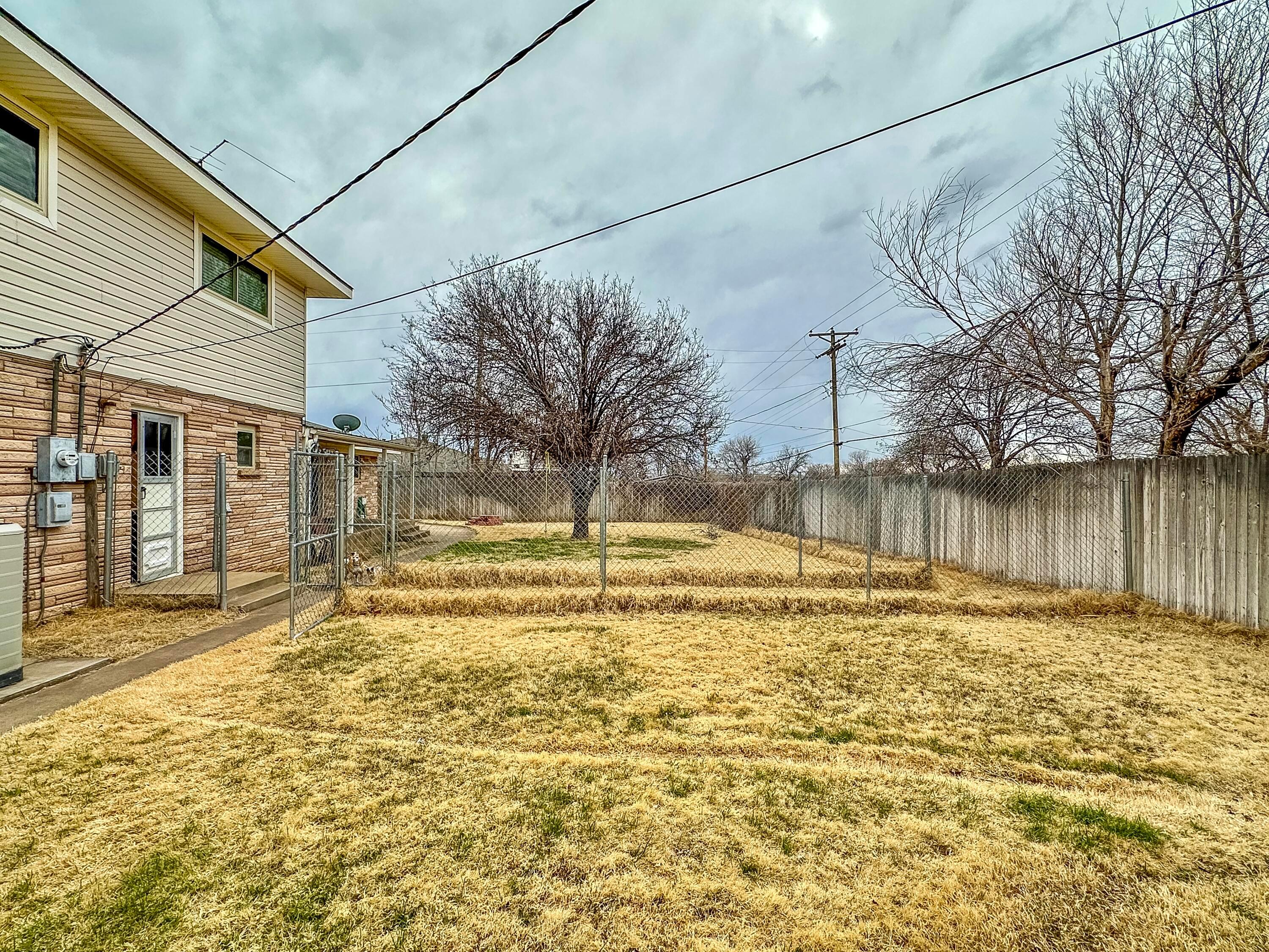 1404 Primrose Lane Borger, TX 79007 - Photo 24 of 27 a swimming pool with outdoor seating and yard