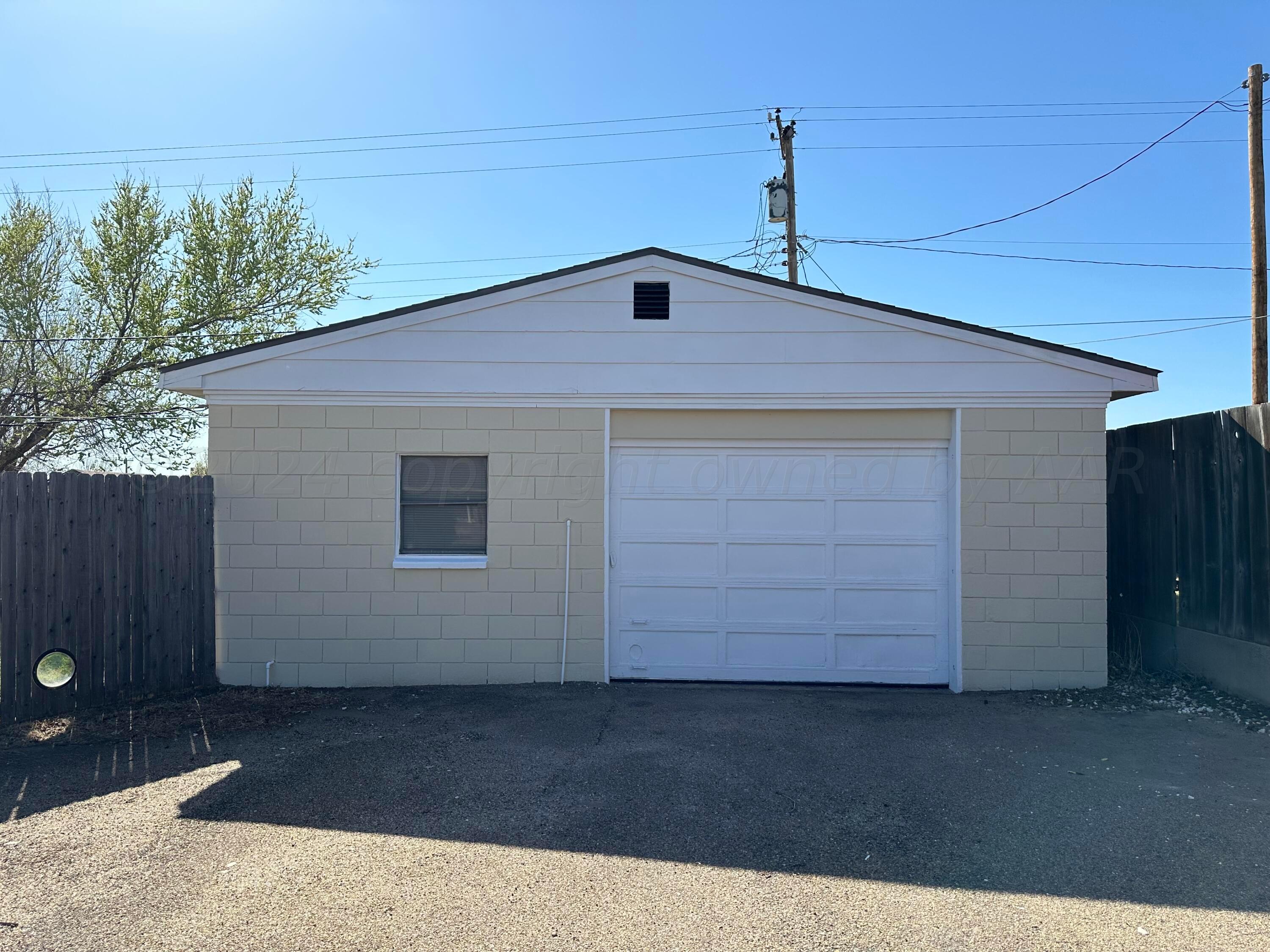 1404 Primrose Lane Borger, TX 79007 - Photo 27 of 27 a front view of a house with a garage