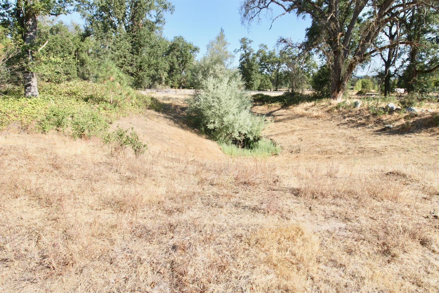 9398 Yuba Ranch Way Oregon House, CA 95962 - Photo 21 of 22 a view of a yard covered with snow on the road