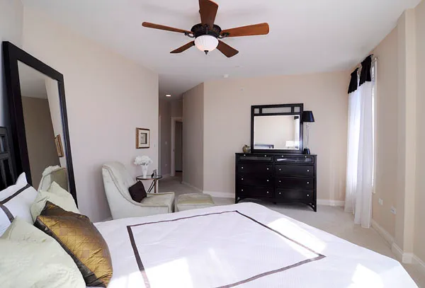 a bedroom with a bed and a dresser