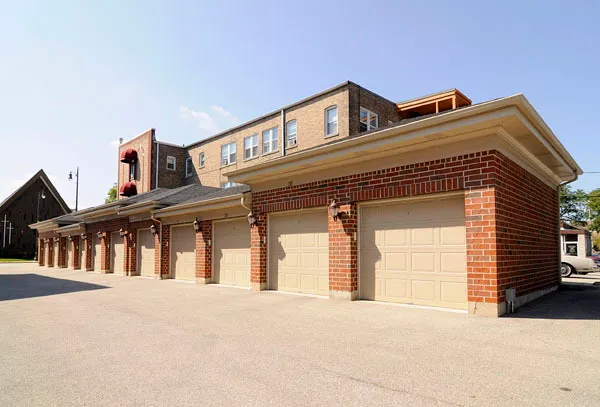 a front view of a house with a garage