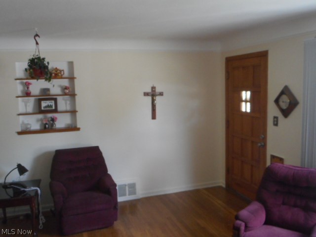15712 Turney Road Maple Heights, OH 44137 - Photo 6 of 19 LIVING ROOM WITH A HARDWOOD FLOOR AND NEUTRAL DECOR.