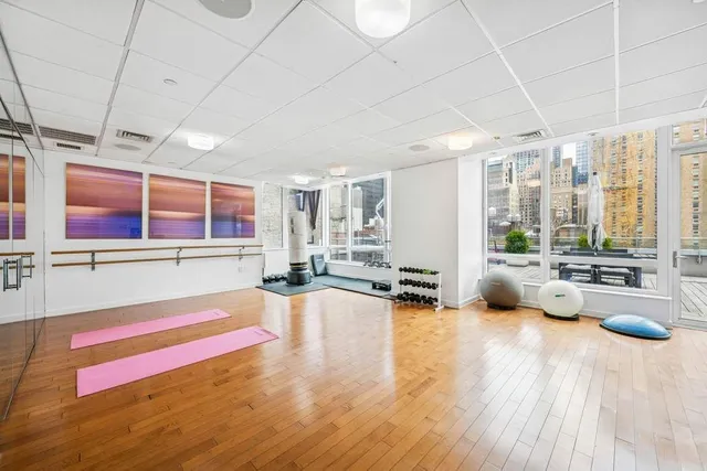 a bathroom with a sink a toilet a glass door shower and a bathtub