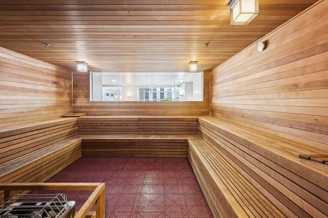 a living room with pool table and a flat screen tv