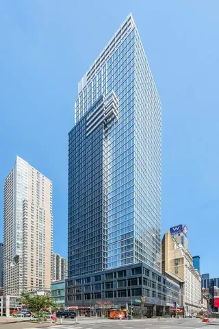 a view of city with a tall building