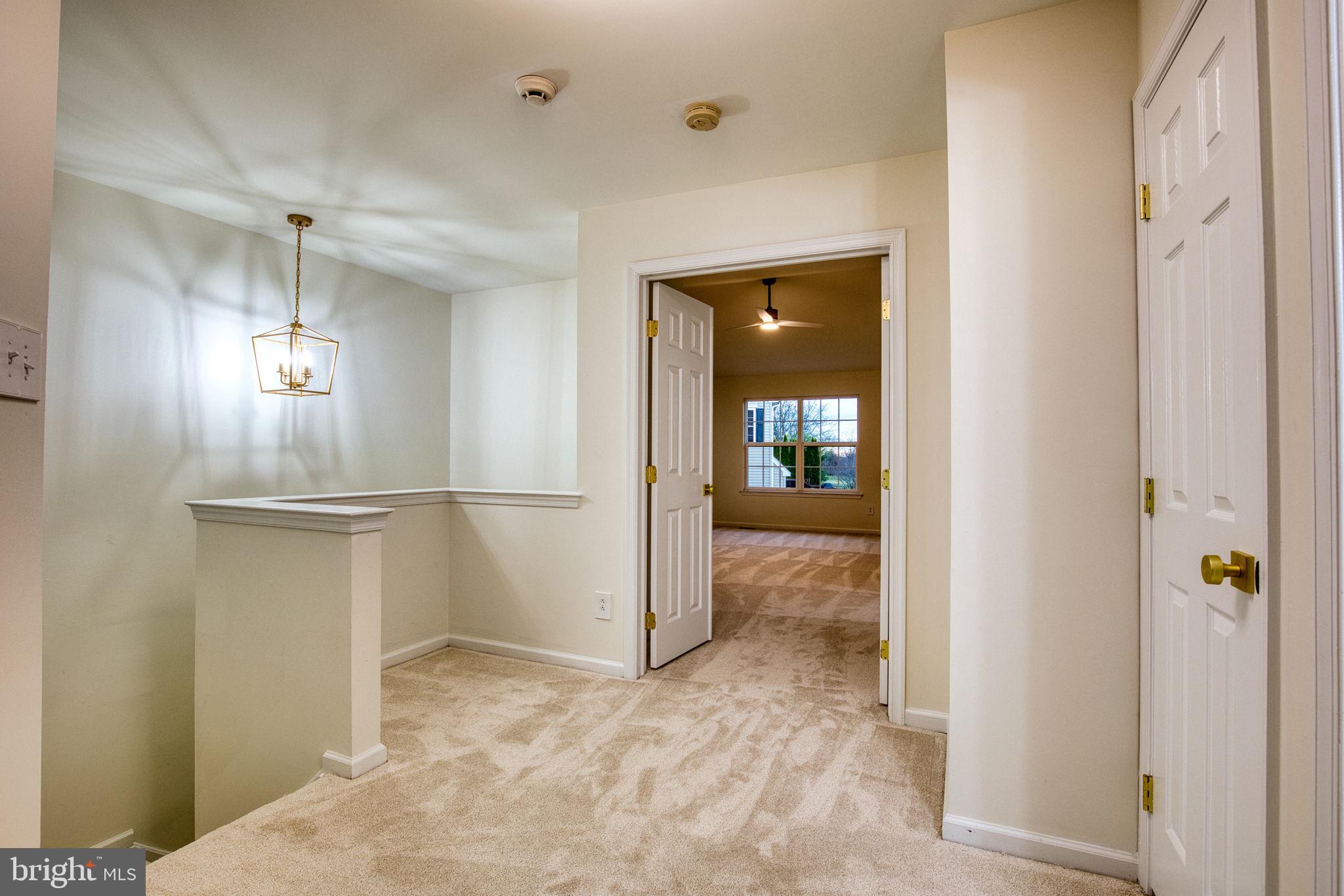 107 Walker Road Royersford, PA 19468 - Photo 17 of 41 a view of a hallway with wooden shelves