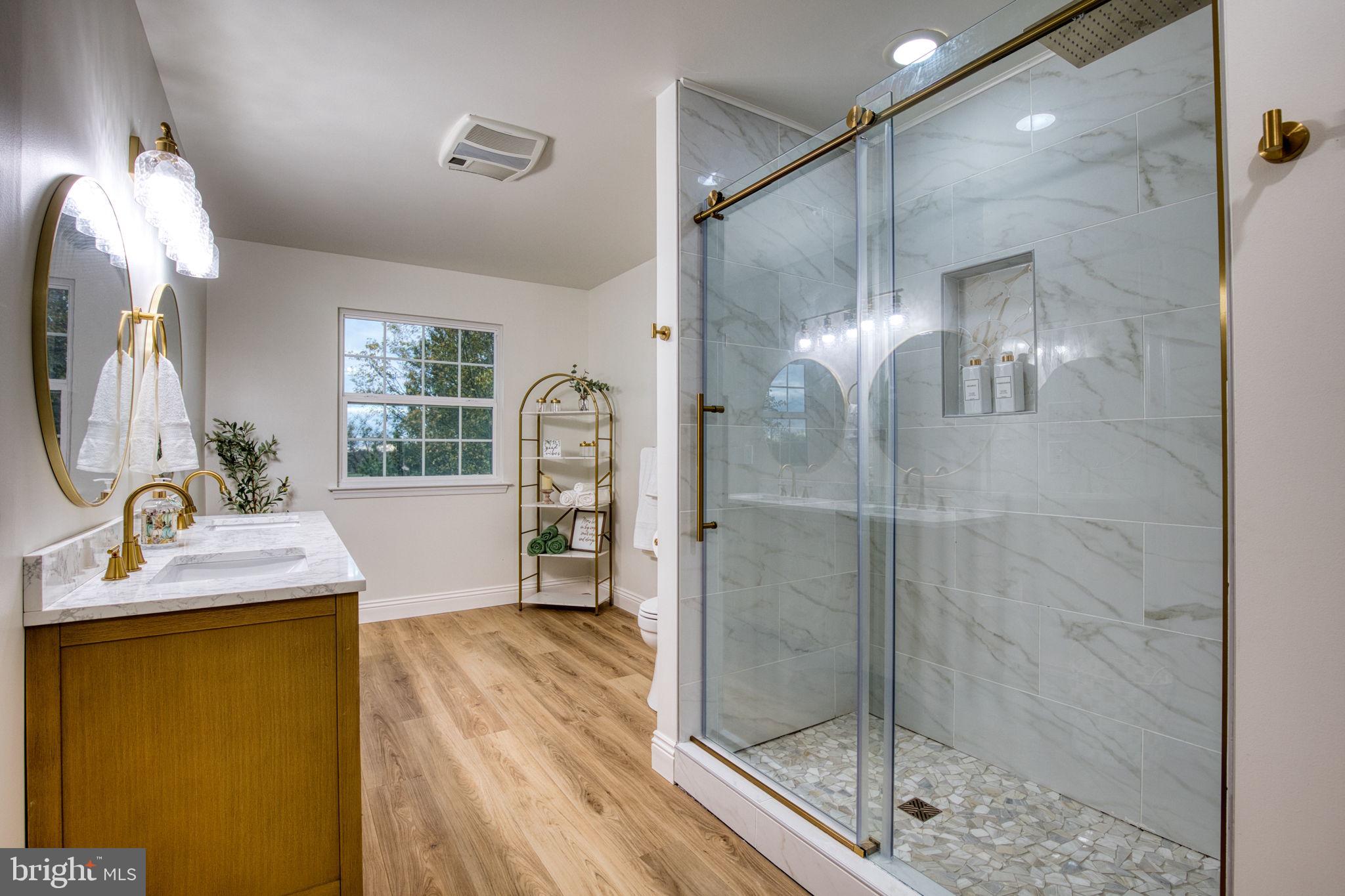 107 Walker Road Royersford, PA 19468 - Photo 21 of 41 a bathroom with a granite countertop sink a mirror and shower