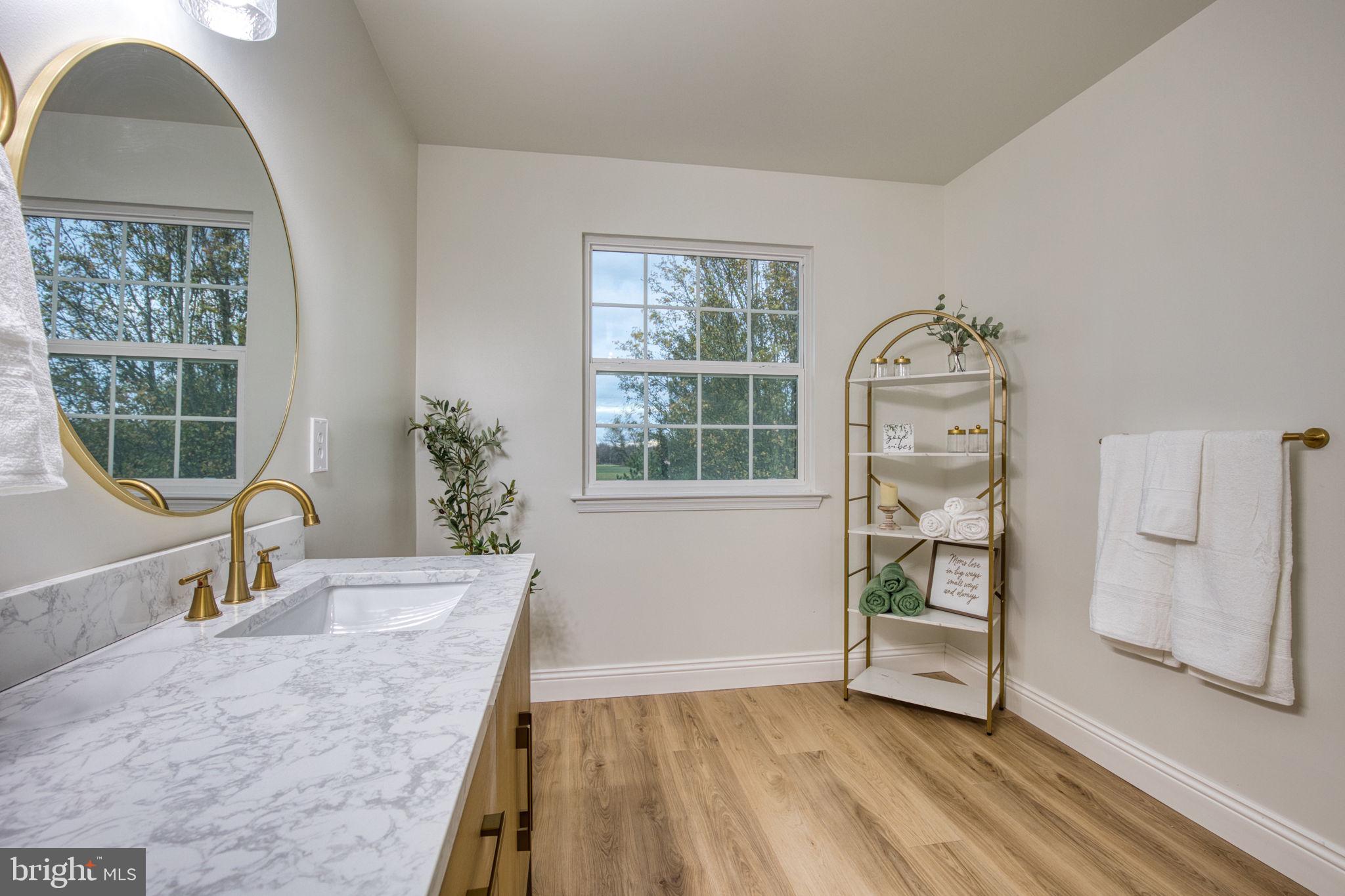 107 Walker Road Royersford, PA 19468 - Photo 22 of 41 a view of a livingroom with wooden floor and a potted plant