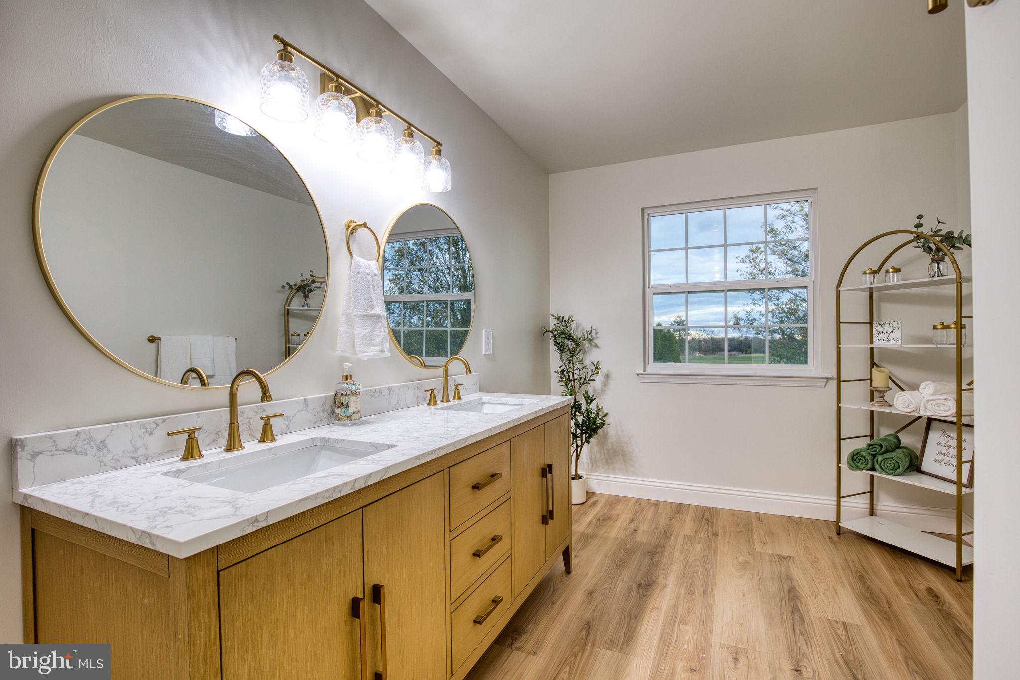 107 Walker Road Royersford, PA 19468 - Photo 23 of 41 a bathroom with a double vanity sink and a mirror