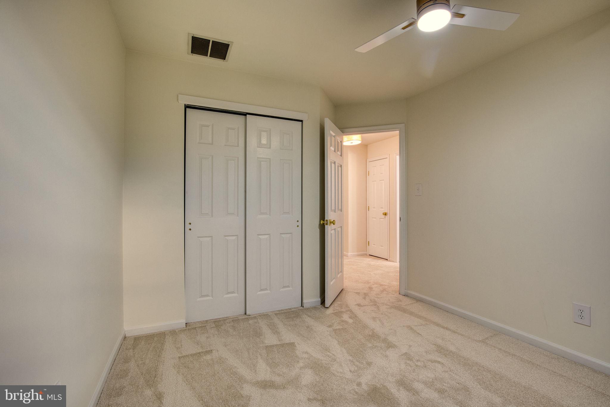 107 Walker Road Royersford, PA 19468 - Photo 26 of 41 an empty room with a chandelier fan