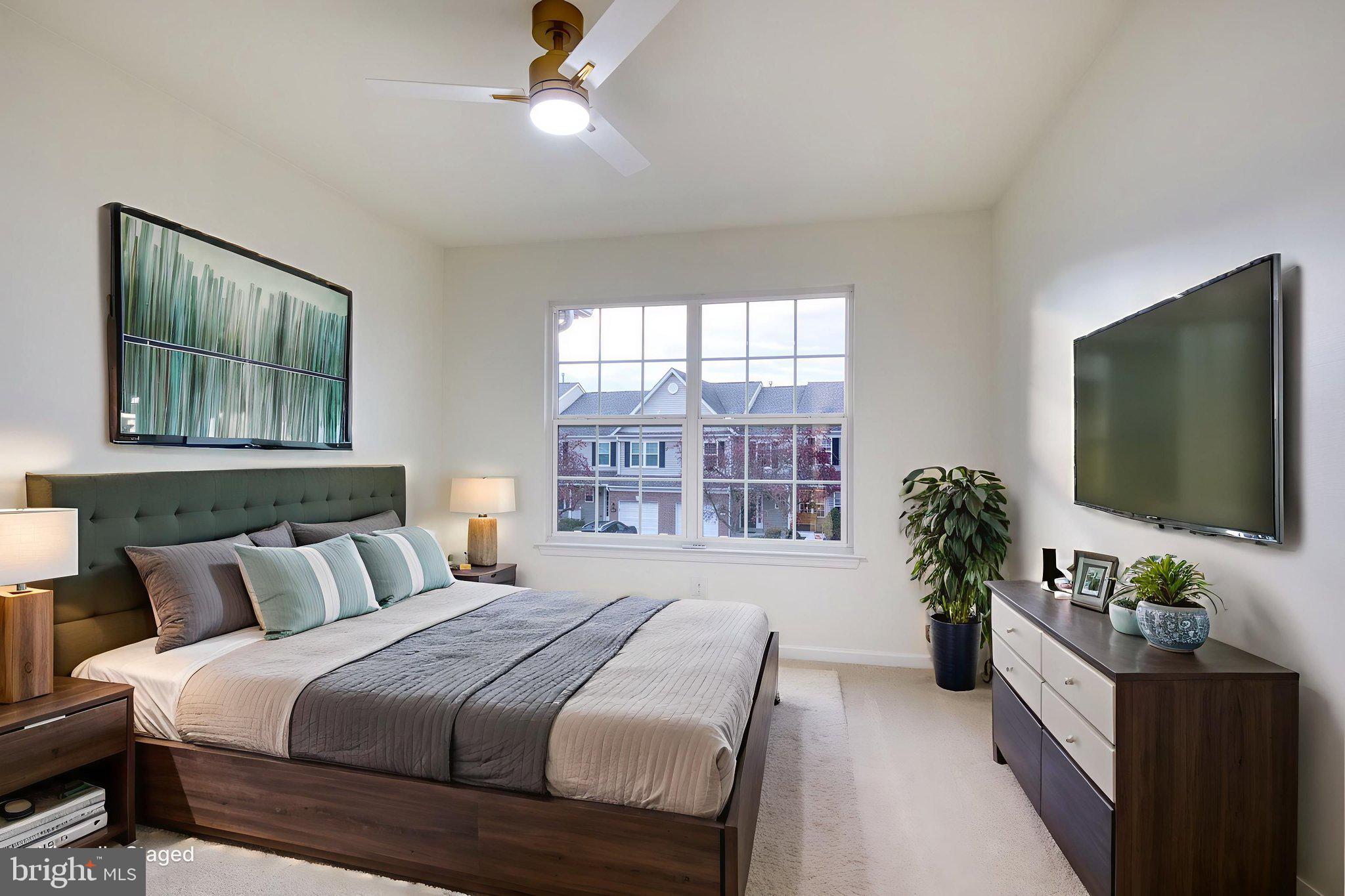 107 Walker Road Royersford, PA 19468 - Photo 28 of 41 a bedroom with a large bed and a flat screen tv