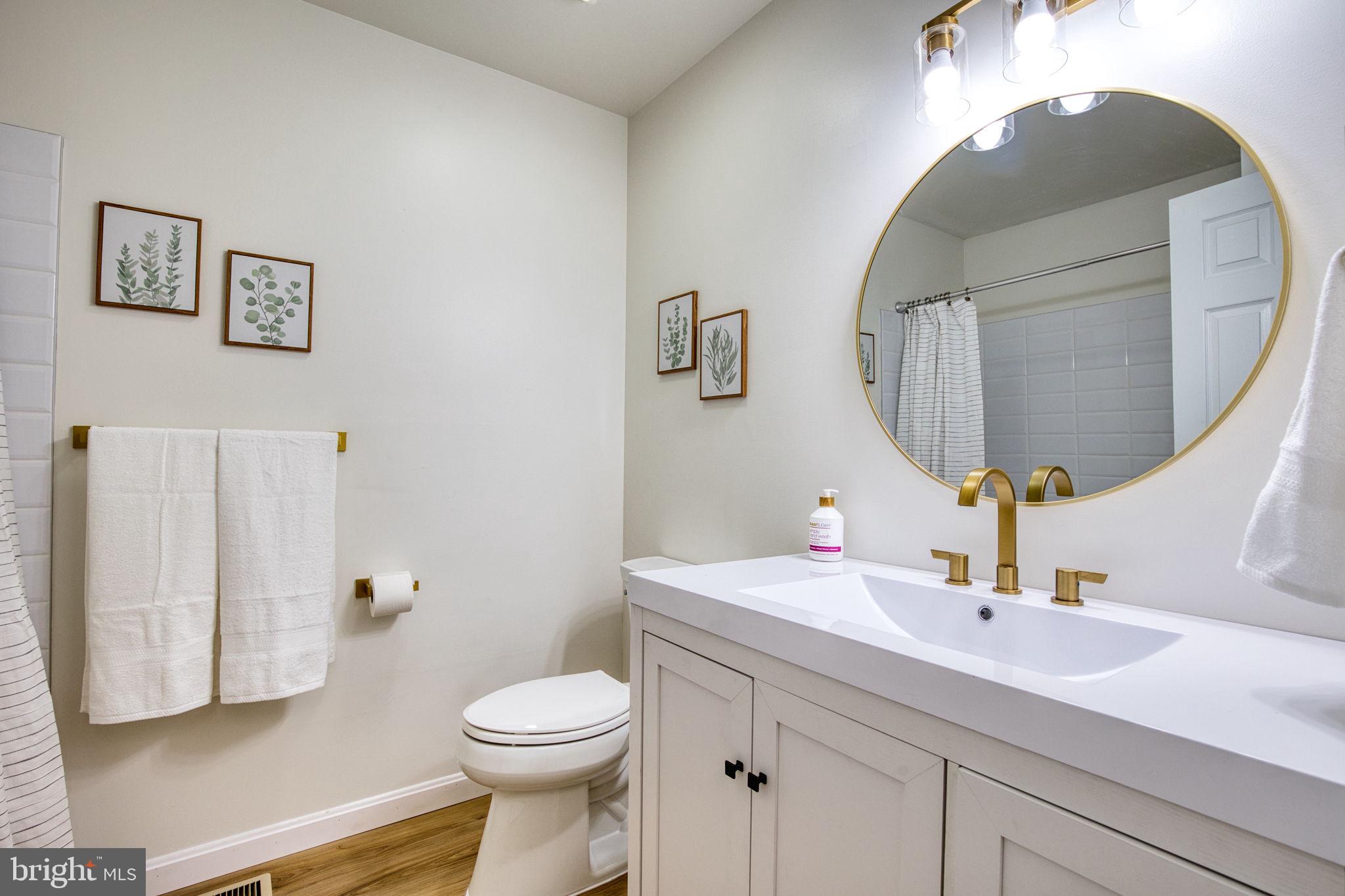 107 Walker Road Royersford, PA 19468 - Photo 32 of 41 a bathroom with a sink mirror and toilet