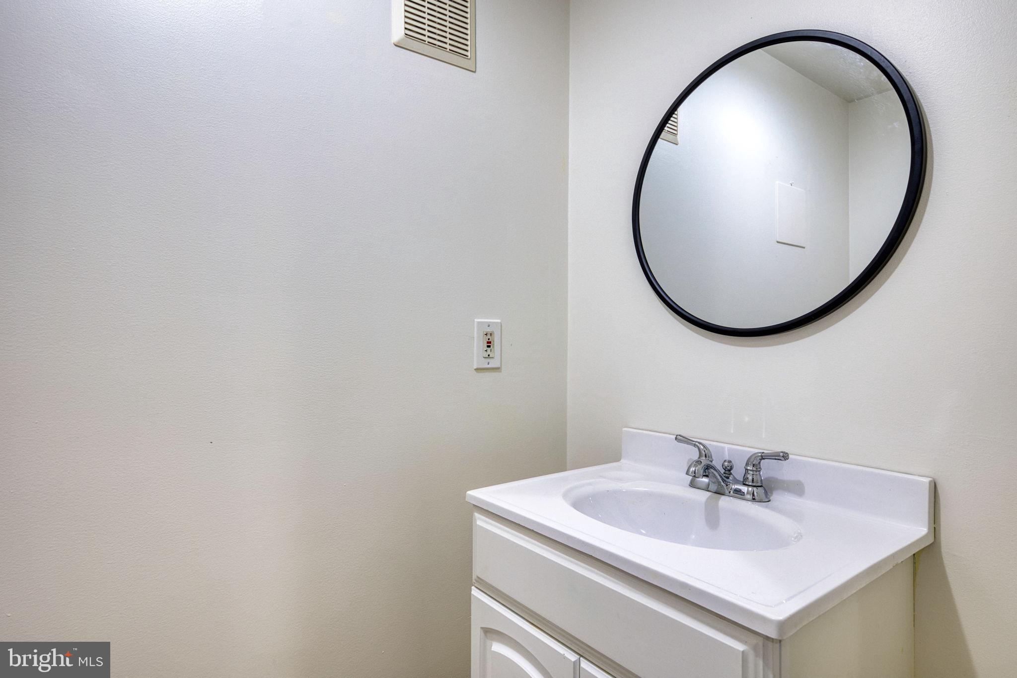 107 Walker Road Royersford, PA 19468 - Photo 37 of 41 a bathroom with a sink and a mirror
