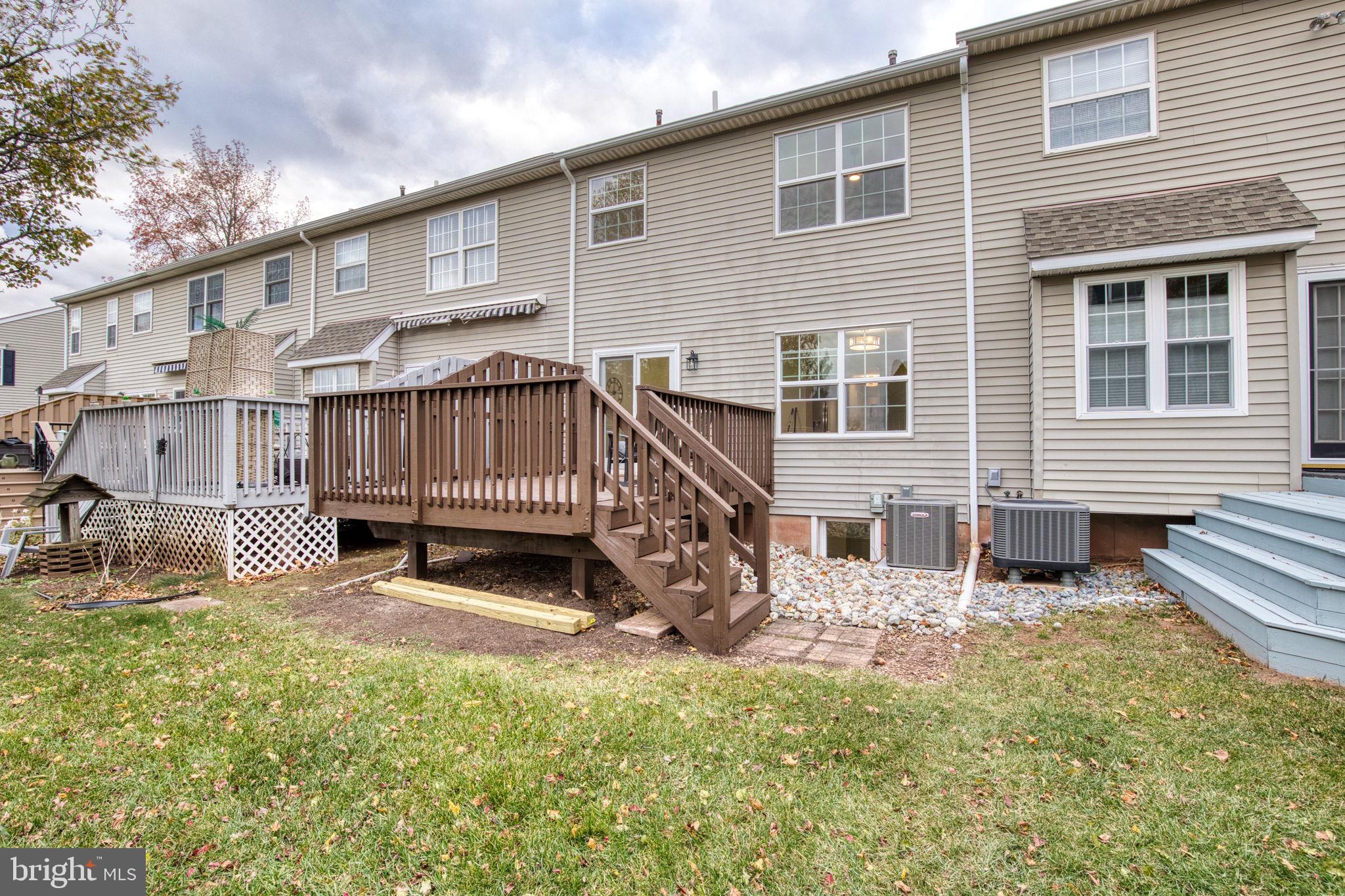 107 Walker Road Royersford, PA 19468 - Photo 40 of 41 a view of a house with a yard and a wooden deck