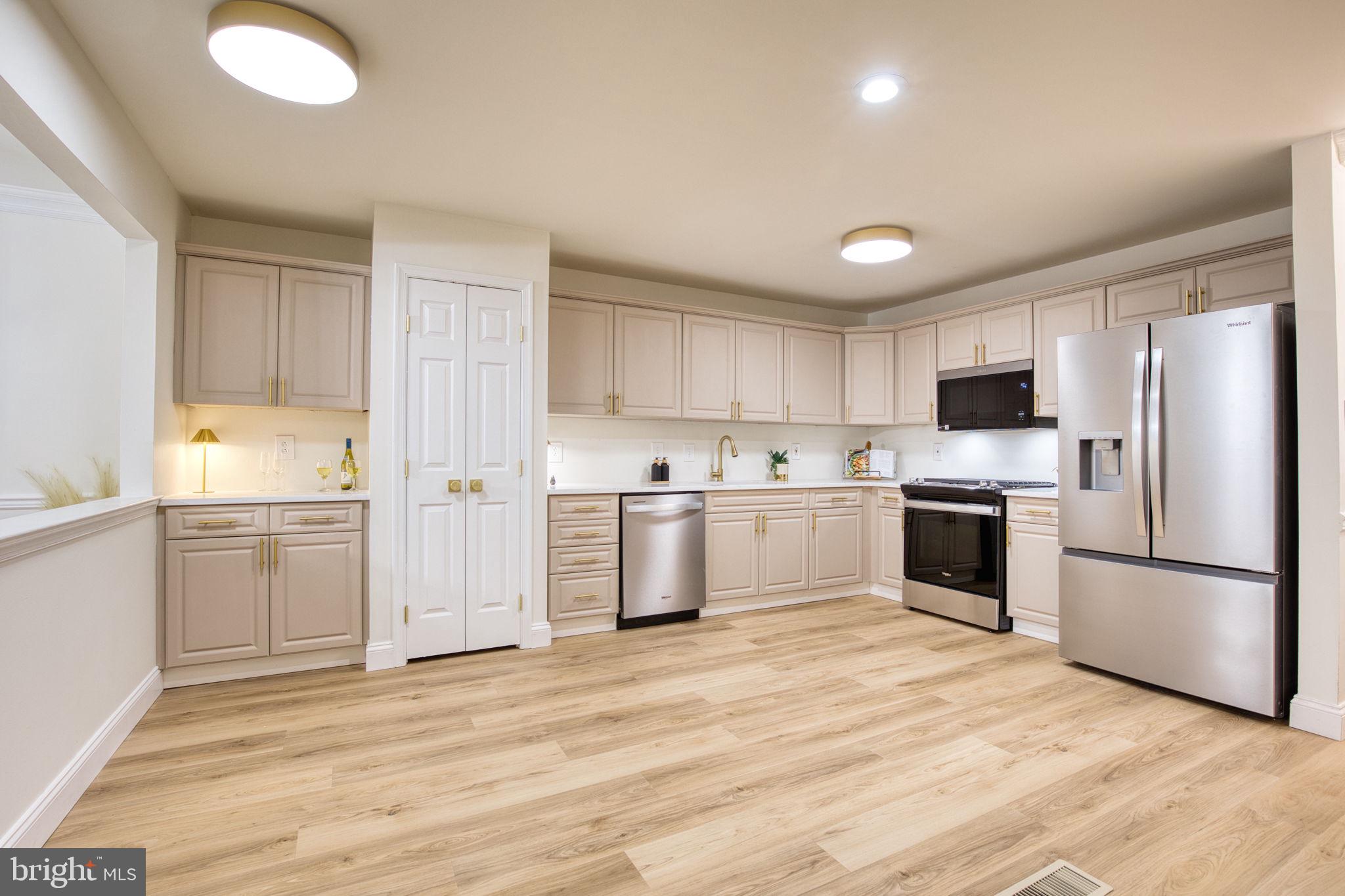 107 Walker Road Royersford, PA 19468 - Photo 5 of 41 a kitchen with white cabinets and stainless steel appliances