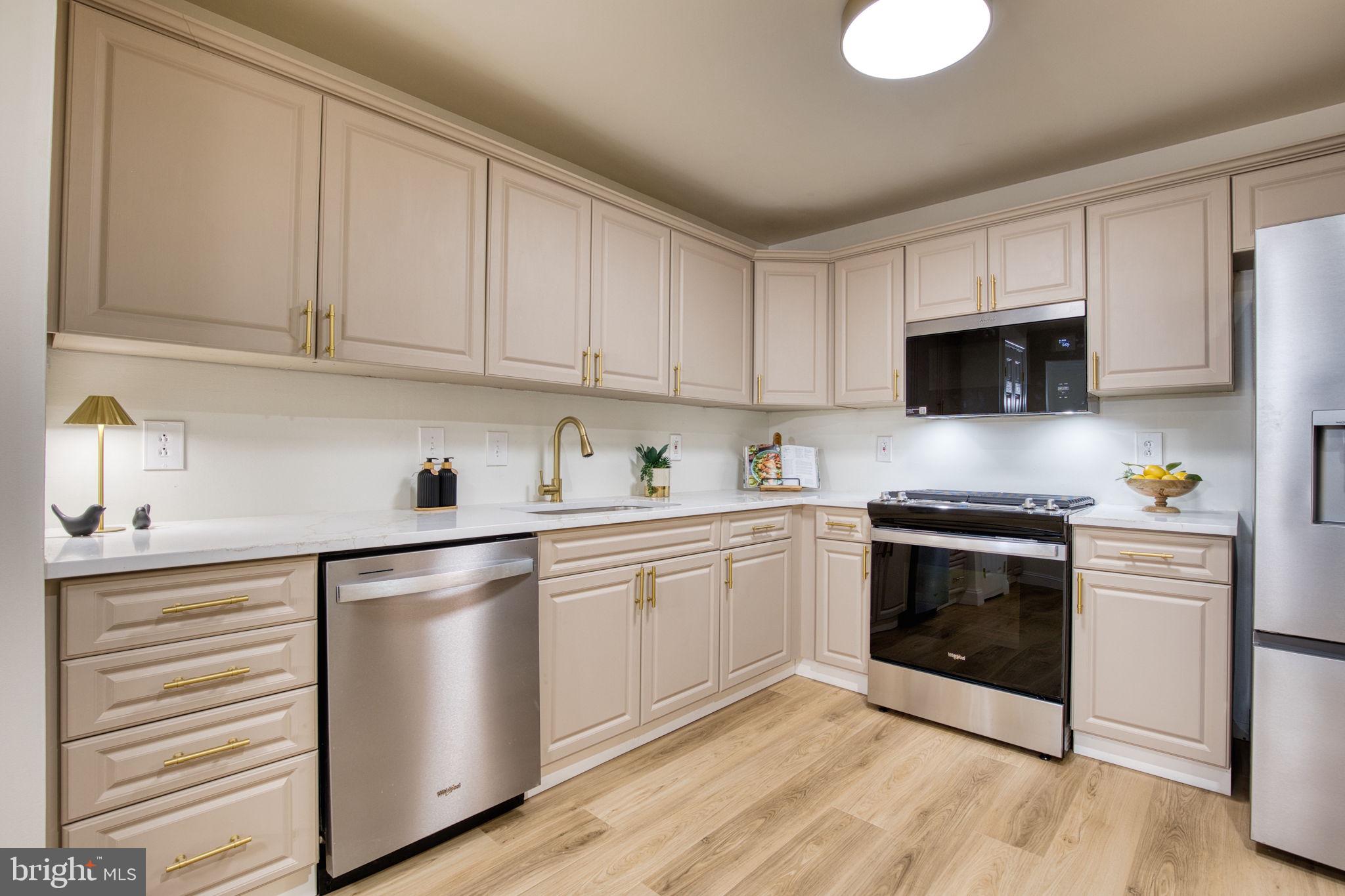 107 Walker Road Royersford, PA 19468 - Photo 6 of 41 a kitchen with granite countertop white cabinets and stainless steel appliances