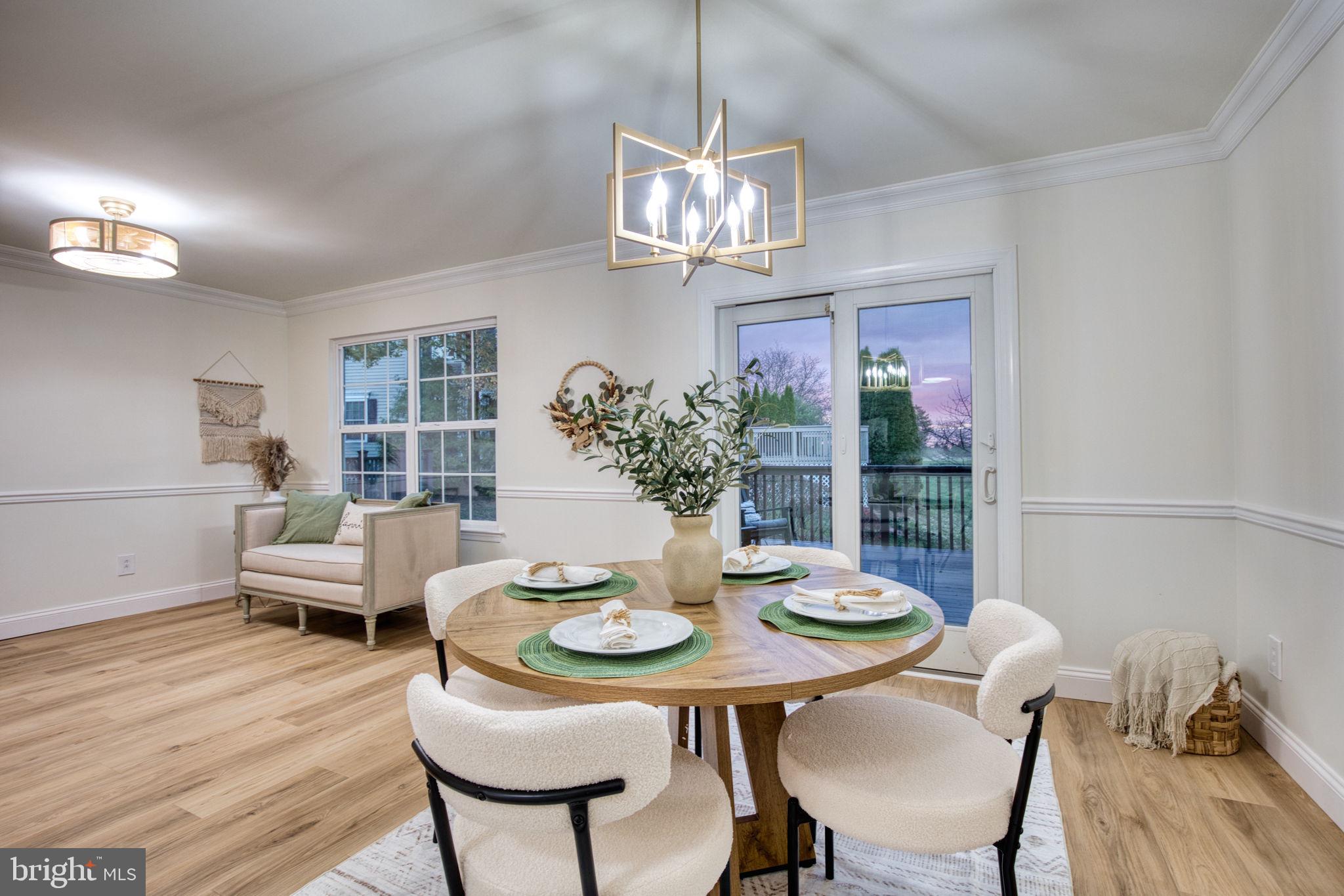 107 Walker Road Royersford, PA 19468 - Photo 10 of 41 a view of a dining room with furniture a chandelier and wooden floor