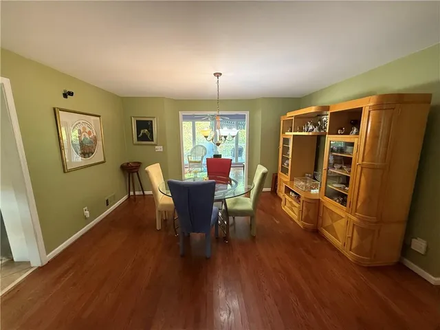 a living room with furniture a window and a flat screen tv