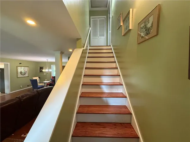 a room with wooden floor and furniture