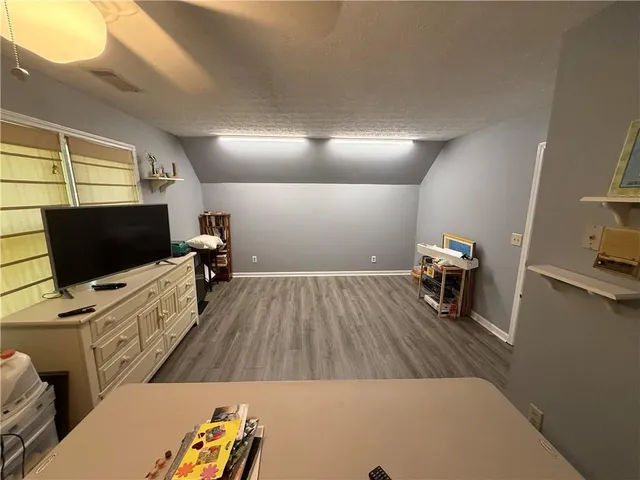 a bathroom with a sink mirror vanity and toilet