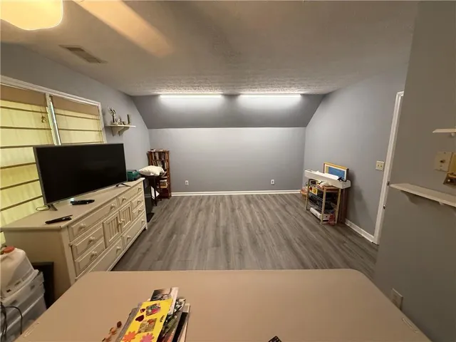 a bathroom with a shower and a toilet