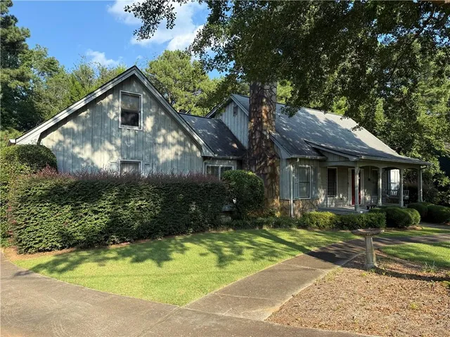 a front view of a house with garden
