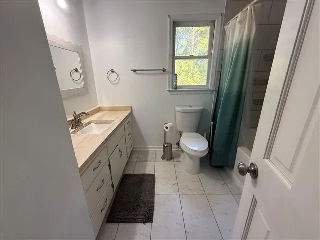 a bedroom with a bed and a table